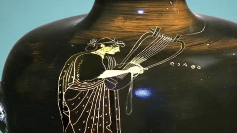 A Greek vase showing the poet Sappho playing an instrument similar a lyre.